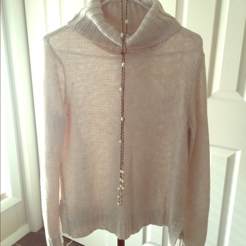 Cream colored turtleneck sweater